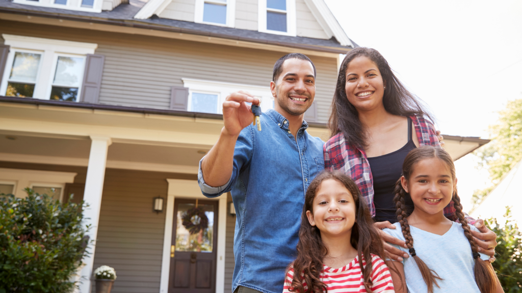 Couple holding their new home key